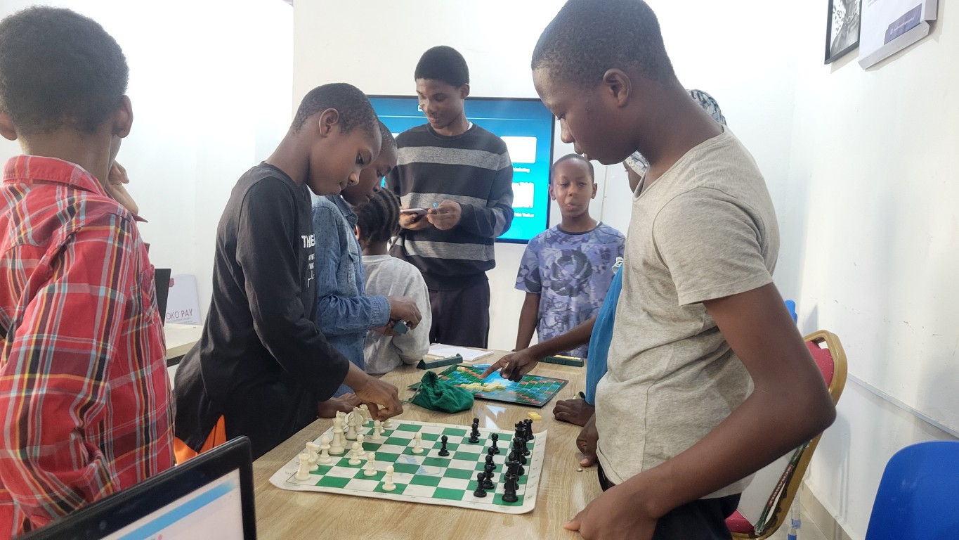 Children learning Scratch programming with visual blocks
